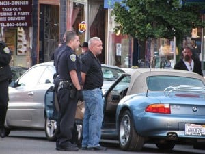 man being arrested by police for dwi