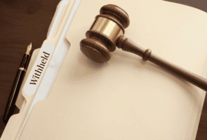 Confidential legal file marked 'Withheld' next to judge's gavel, symbolizing evidence disclosure issues in Michael Morton Act Texas